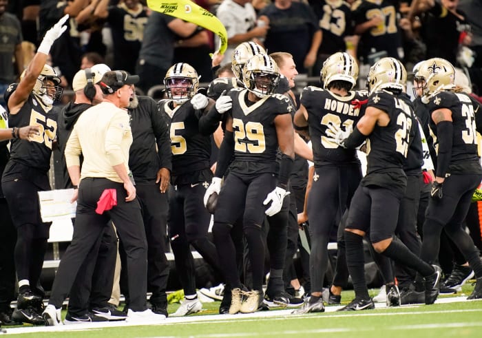 New Orleans Saints cornerback Paulson Adebo (29) celebrates intercepting a Titans pass